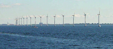 Middelgrunden offshore wind park.  Danish wind turbines near Copenhagen.: Wind often flows briskly and smoothly over water since there are no obstructions. The large and slow turning turbines of this offshore wind farm near Copenhagen take advantage of the moderate yet constant breezes at this location. While the wind at this location is not strong it is very consistent, with the turbines generating substantial power over 97 percent of the time.  Photograph courtesy of English Wikipedia, original upload 15 July 2004 by Leonard G.