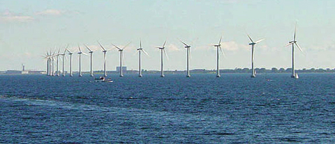 Middelgrunden offshore wind park.  Danish wind turbines near Copenhagen.: Wind often flows briskly and smoothly over water since there are no obstructions. The large and slow turning turbines of this offshore wind farm near Copenhagen take advantage of the moderate yet constant breezes at this location. While the wind at this location is not strong it is very consistent, with the turbines generating substantial power over 97 percent of the time.  Photograph courtesy of English Wikipedia, original upload 15 July 2004 by Leonard G.