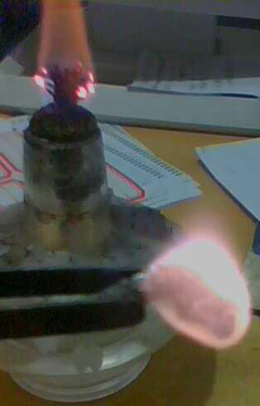 Arsenic burning in the air.: Photograph by Léiem courtesy of Wikipedia