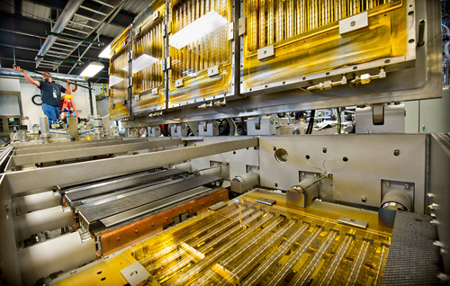 Ampulse Corporation is installing a pilot production line in the Process Development Integration Laboratory (PDIL) at NREL.: It represents a new, less wasteful way of making solar cells and should result in less expensive devices. Credit: Dennis Schroeder